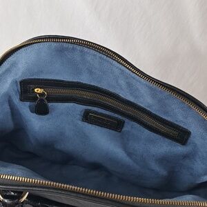 ZINA EVA Black textured vegan leather tasseled zipper closure